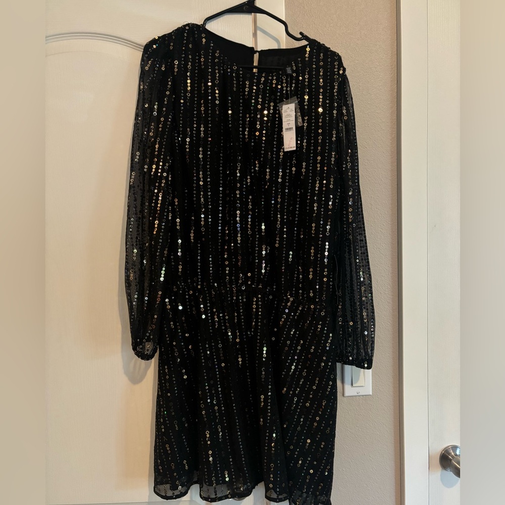 White House Black Market black knee length dress with gold sequins.